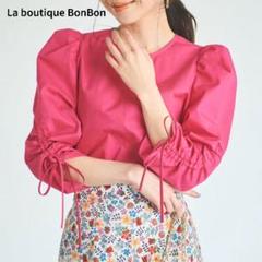新品未使用♡ラブティックボンボン 二ドムダンプドロストスリーブブラウス リボンe