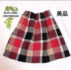 美品✨ブルーレーベルクレストブリッジ　チャーム付き　膝下フレアスカート　赤36 BLUE LABEL CRESTBRIDGE - 【新品】ブルーレーベルクレスト