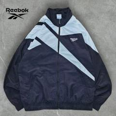 人気90sモノクロREEBOKナイロンジャケット 古着ビッグロゴ白黒 刺繍