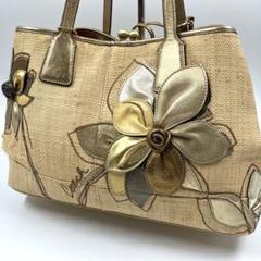 限定モデル　COACH　フローラルストローキャリーロール　カゴバック　がま口　花