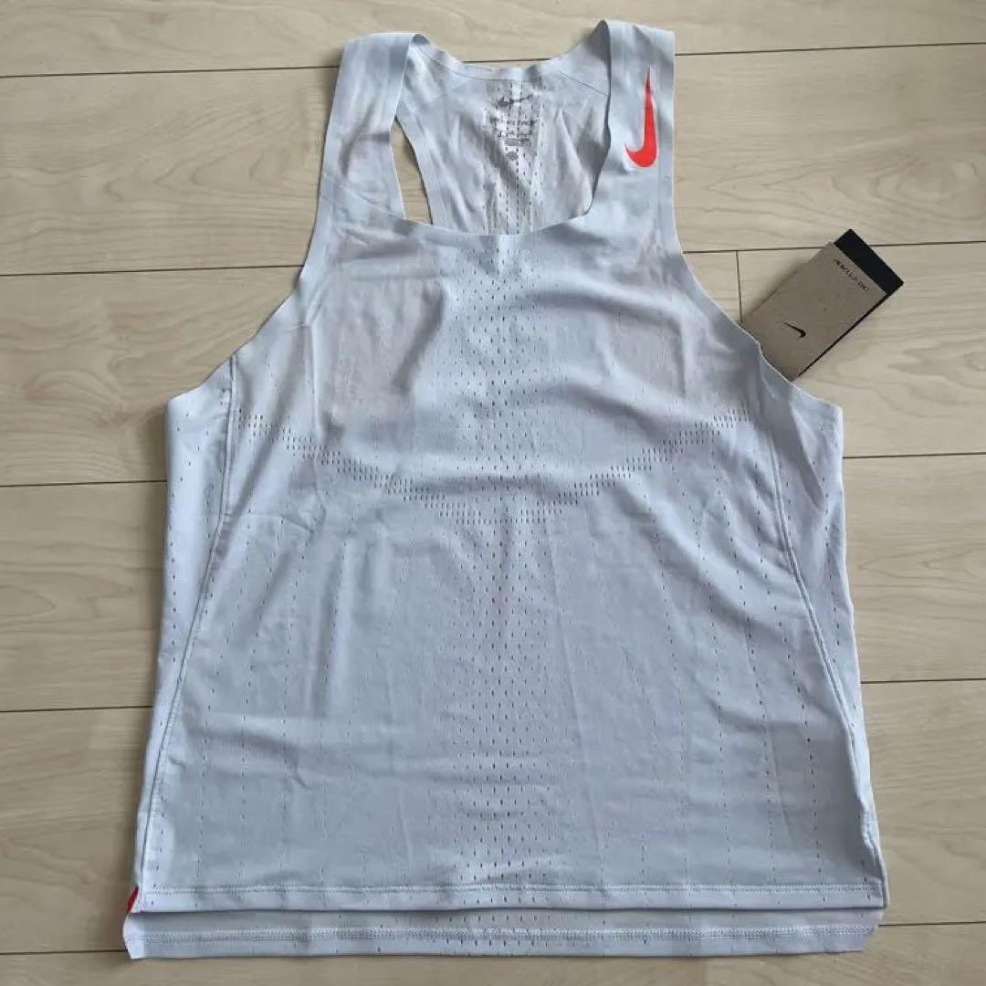 パーティを彩るご馳走や NIKE エアロスイフト L ホワイト オレンジ T