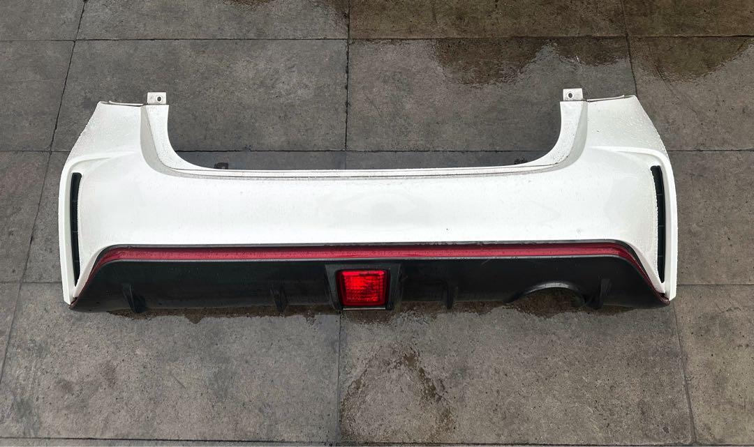 E12 ノートNISMO リアバンパーくカラーNO。QAB DBA-E12