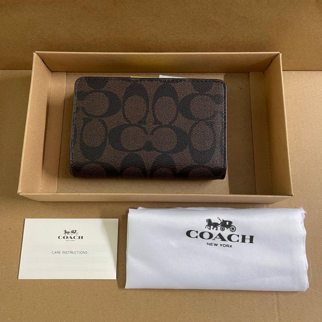 新品 COACHシグネチャーキャンパス・カラーブロックインテリア 二つ折り財布 - メルカリ