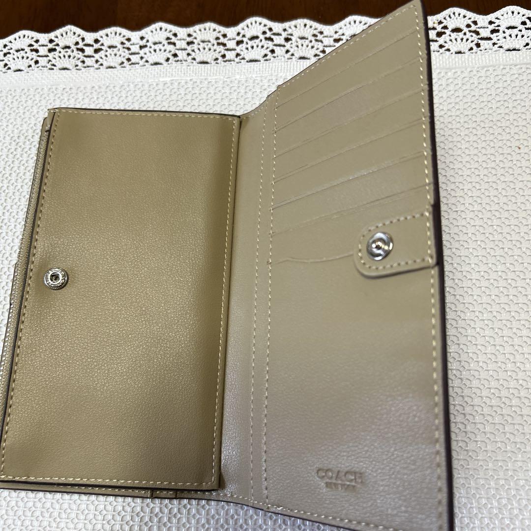 未使用に近い COACHレザー二つ折り長財布紫レディース財布