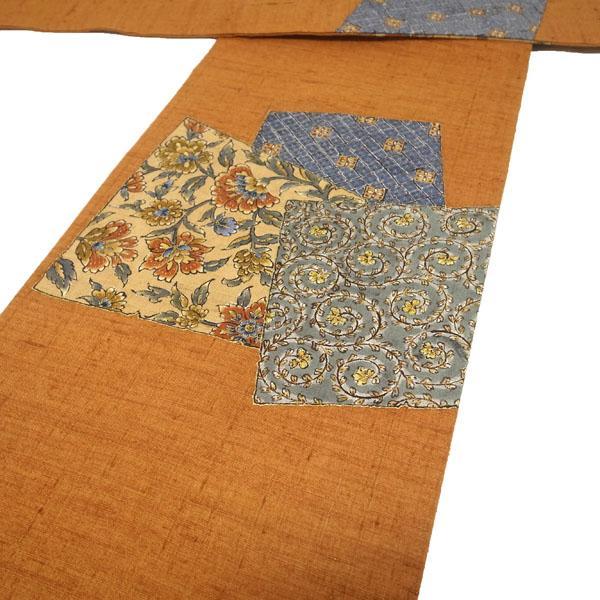 名古屋帯 九寸 紬 手描き 手織り 更紗 花唐草 茶オレンジ kp1874