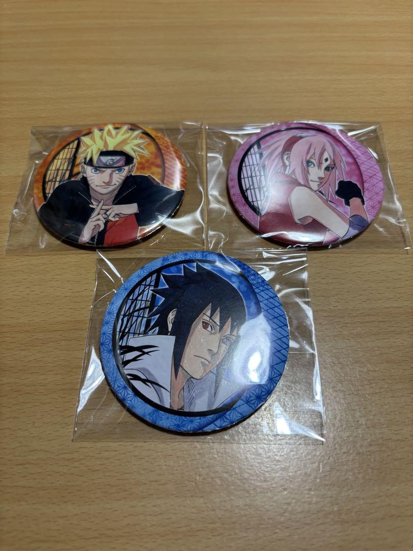 ナルト展　缶バッジ５個セット　ナルト、さくら、サスケ、ガイ＆ロックリー、イタチ