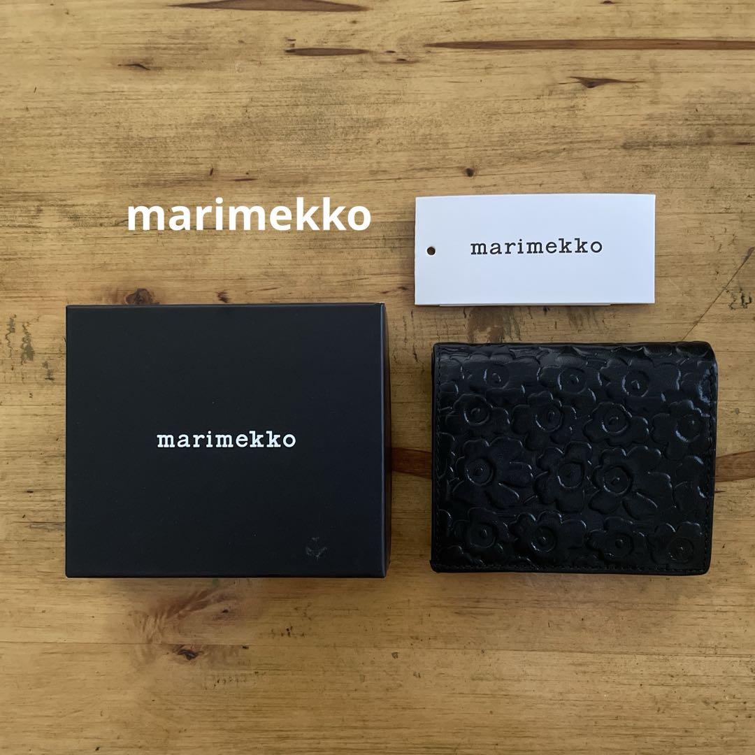 marimekko ウニッコ型押し 二つ折り 黒財布 marimekko ウニッコ型押し 二つ折り 黒財布