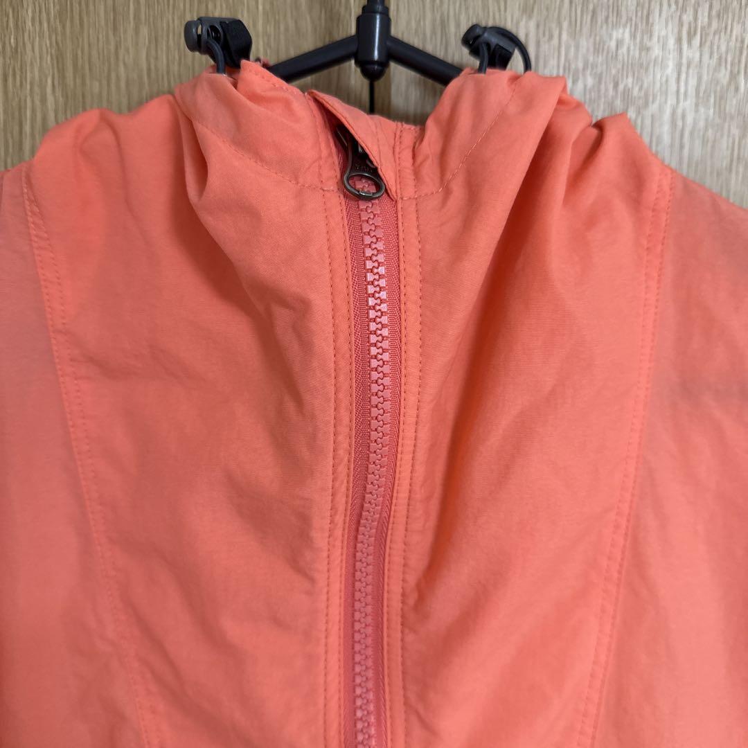 THE NORTH FACE フード付きウィンドブレーカー オレンジ