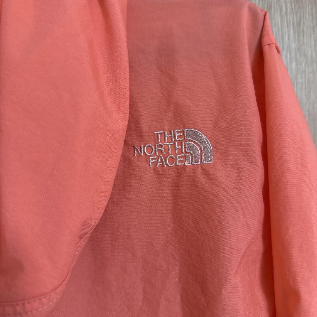 THE NORTH FACE フード付きウィンドブレーカー オレンジ