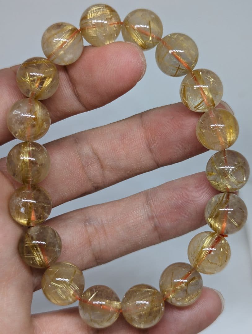 人気絶頂 11.5-12mm ゴールドタイチンルチルクォーツ ブレスレット