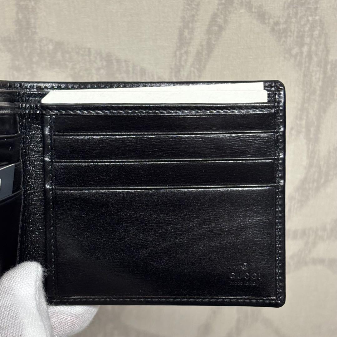 新品GUCCI グッチ　ブラックレザー 二つ折り財布Gロゴ　 札入れ　R