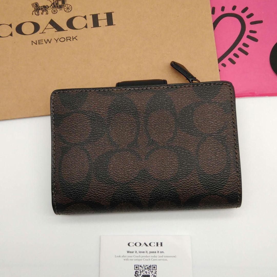 新品　COACH　折り財布　レディース　シグネチャー柄