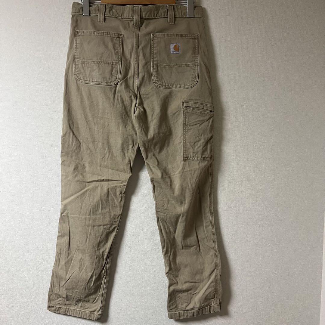 新しいスタイル Carhartt（カーハート）ワークパンツ/34/カーキ/US古着 - メルカリ パンツ