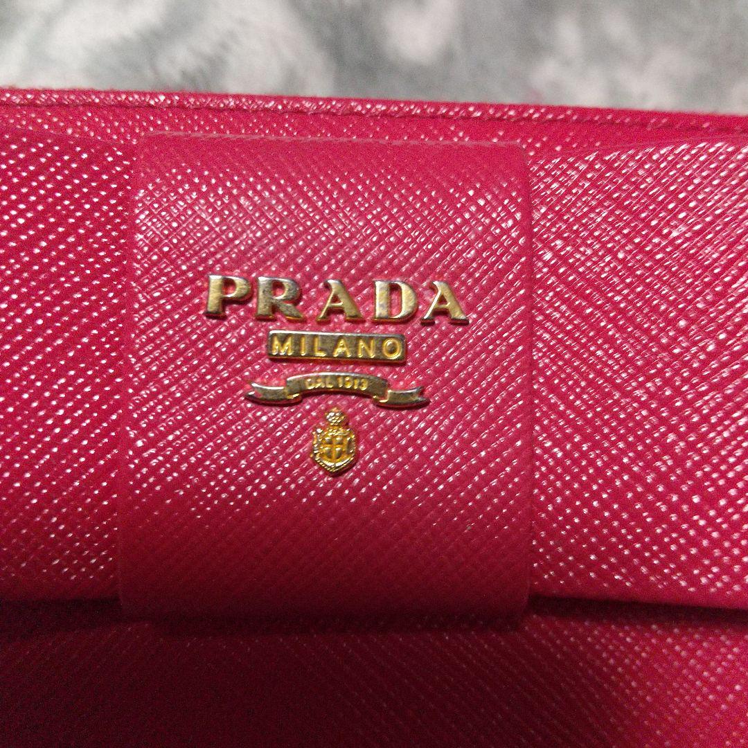 PRADA ラウンドファスナーリボン付き長財布 レッド