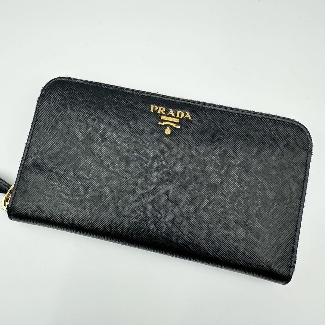 0225 PRADA プラダ　長財布　ラウンドジップ　サフィアーノ　黒　金ロゴ 14,800円