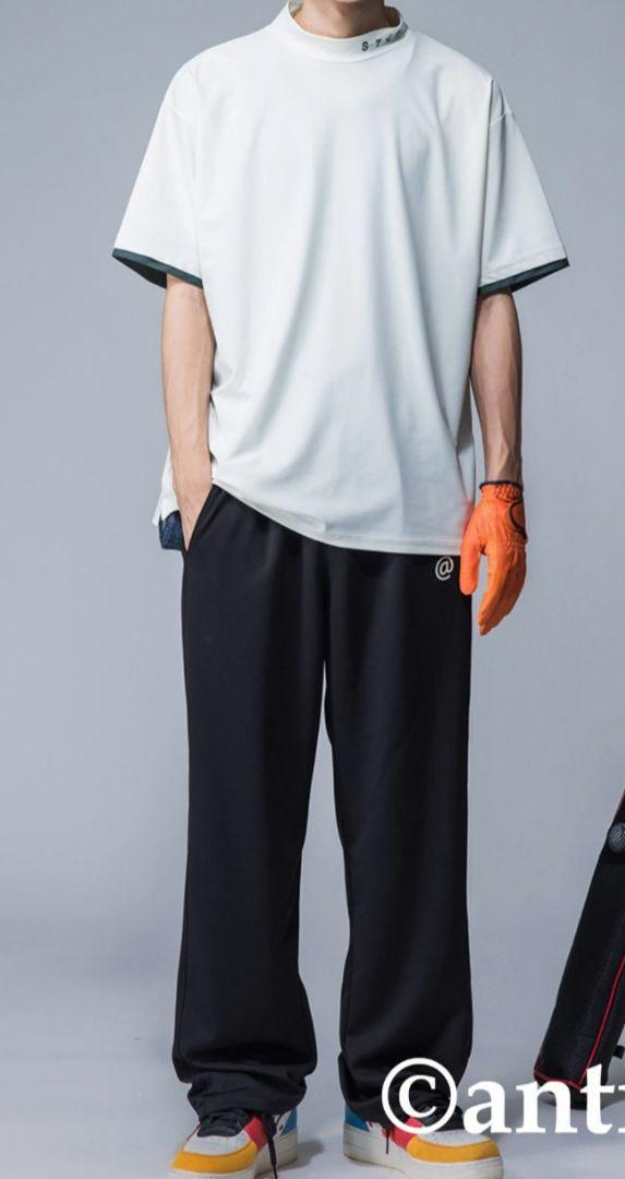 アンティカ ゴルフ STCH オーバーサイズロゴ入りトップス GOLF