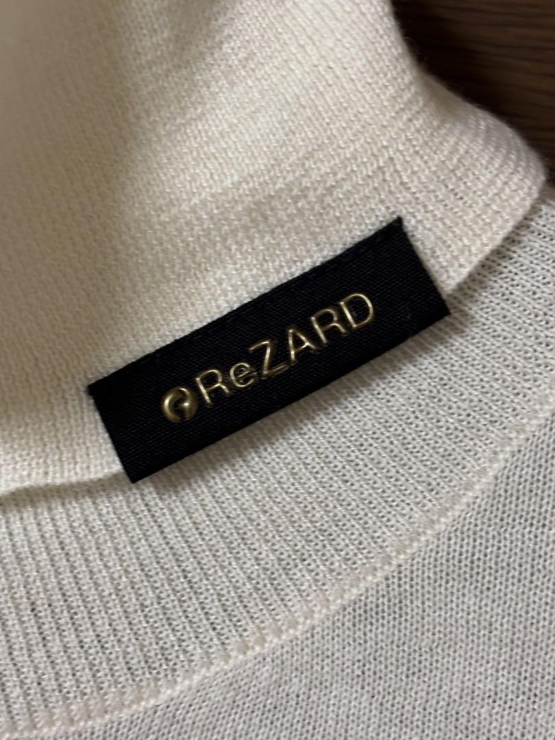 パーティを彩るご馳走や ReZARD ホワイト タートルネックニット トップス