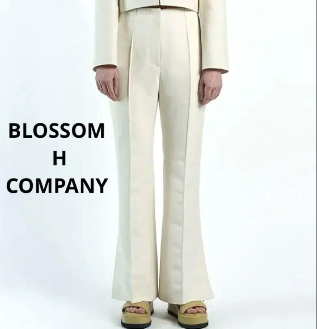 BLOSSOM H COMPANY ホワイト フレアパンツ スリット