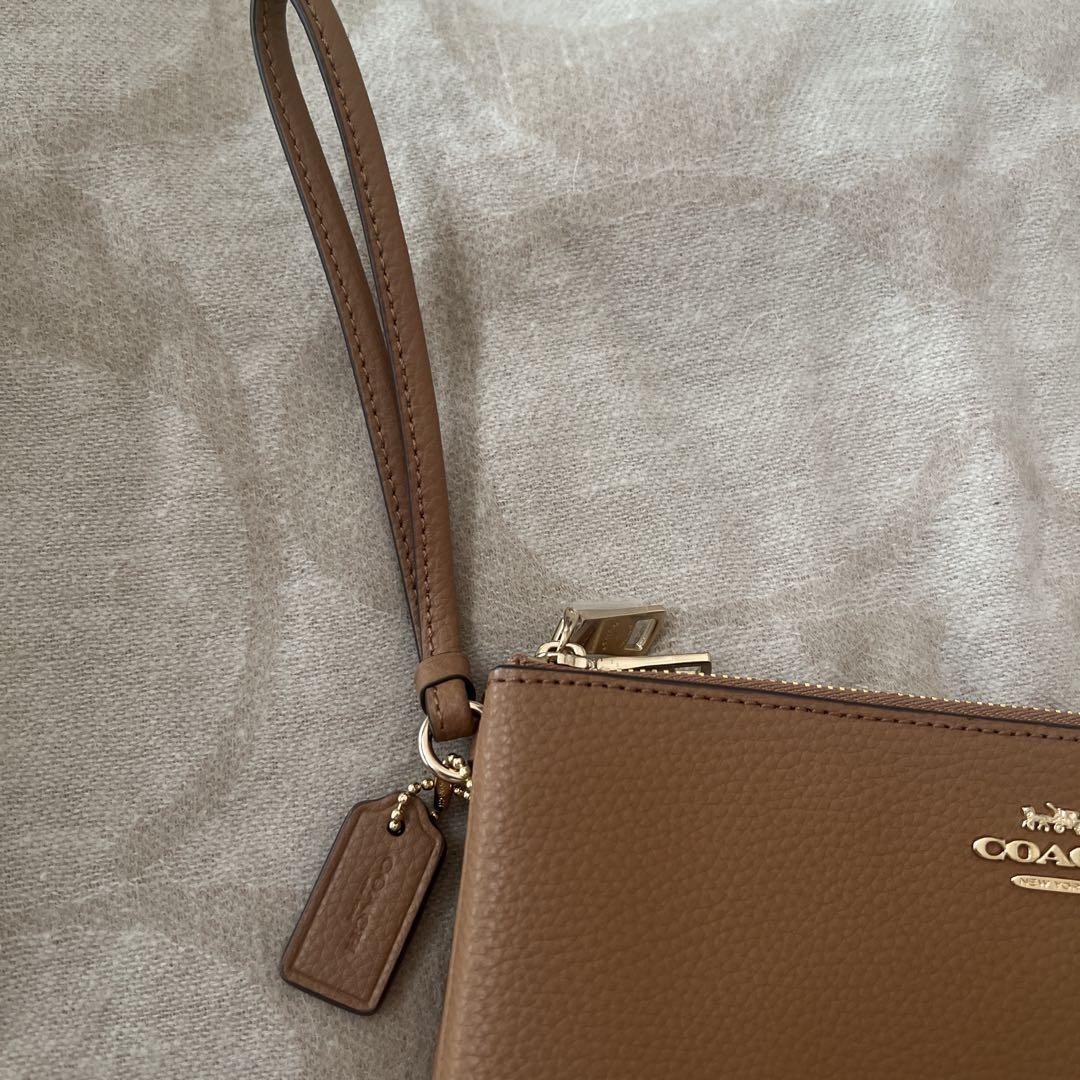 新品 COACH ブラウンレザーポーチ - メルカリ