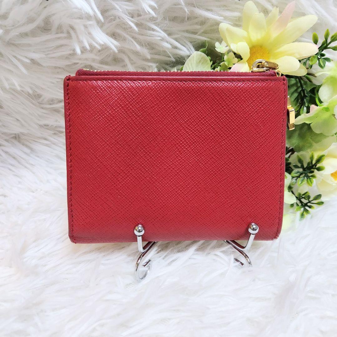 半額ストア 希少デザイン✨プラダ♡りぼんチャーム 二つ折り財布 ゴールド 小物