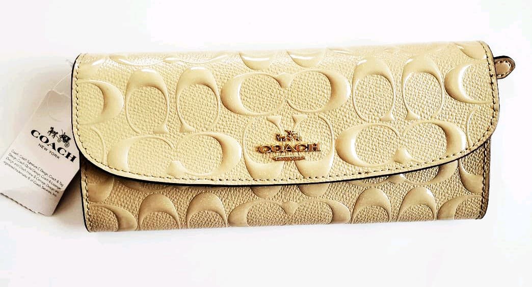 ❣️セール】COACH ☆新品 長財布チャームつき 桃太郎さま専用)新品