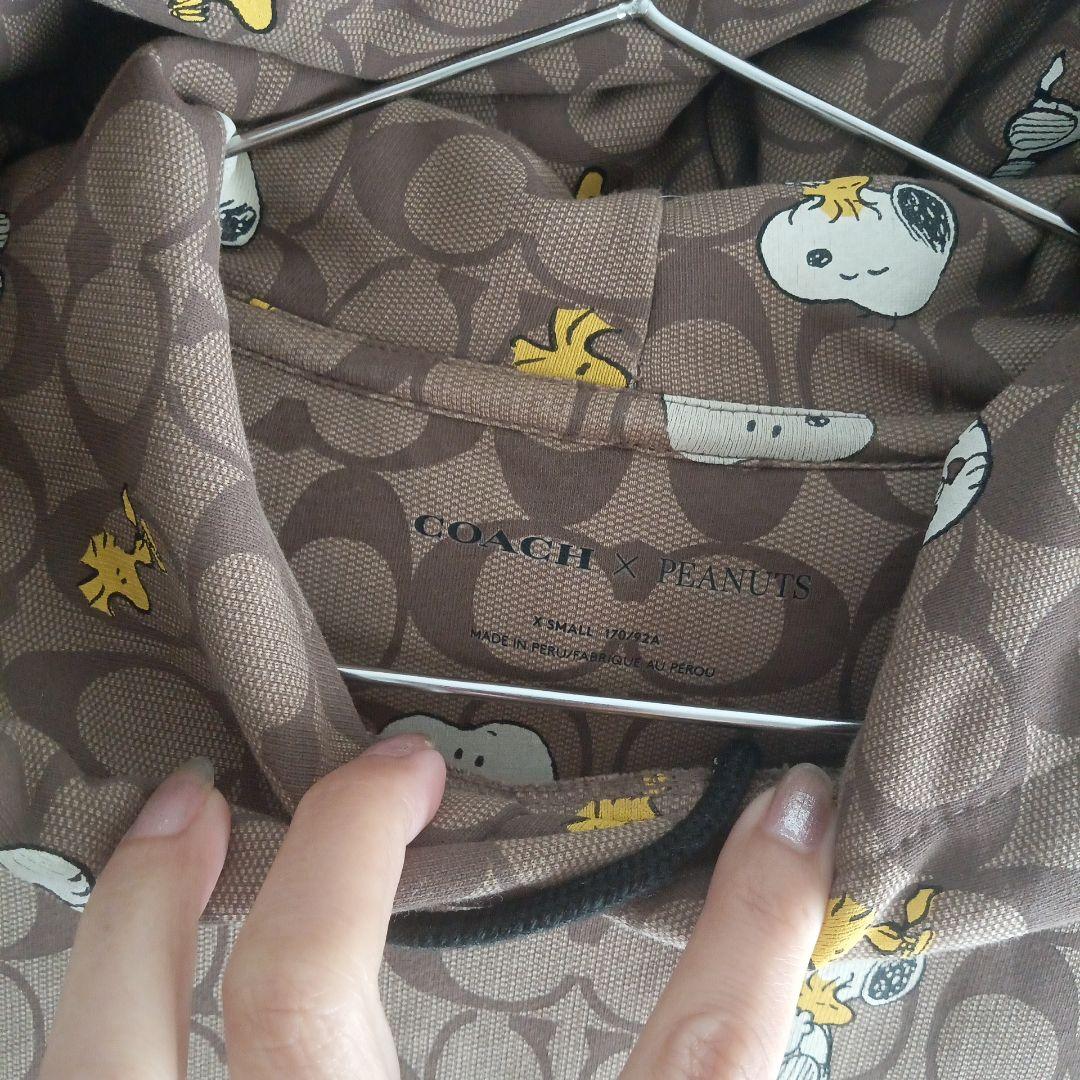 ゆ*え様 COACH×PEANUTS　スヌーピー柄ブラウンパーカー【オークション