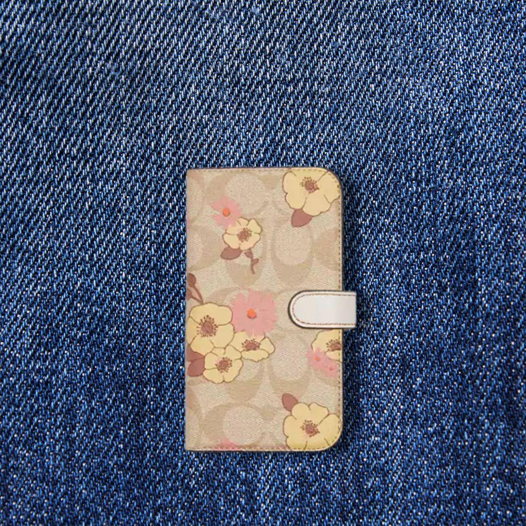 COACH iPhone14Pro用シグネチャー手帳型ケース フローラル