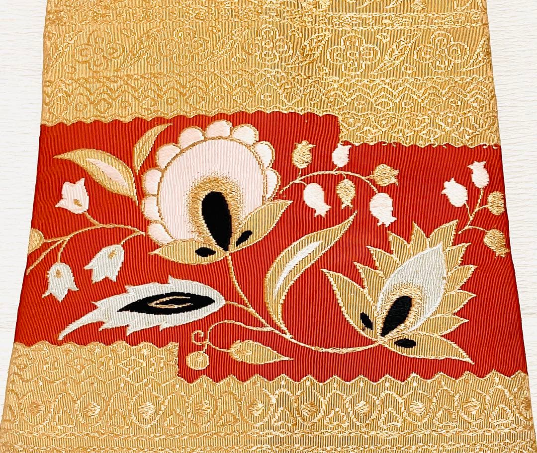 名古屋帯 アンティーク スズラン 花文様 金糸 オレンジ ゴールド 花柄 春着物