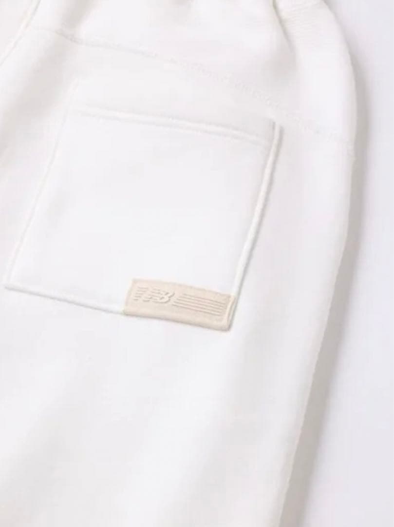 新品・未使用】ニューバランス スウェットプルオーバーフーディ