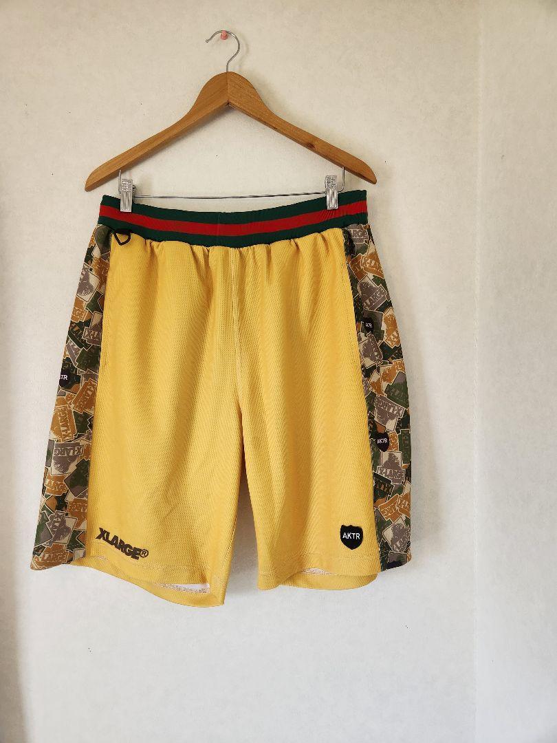 XLARGE ×AKTRコラボバスケットボールパンツ メッシュ 黄色