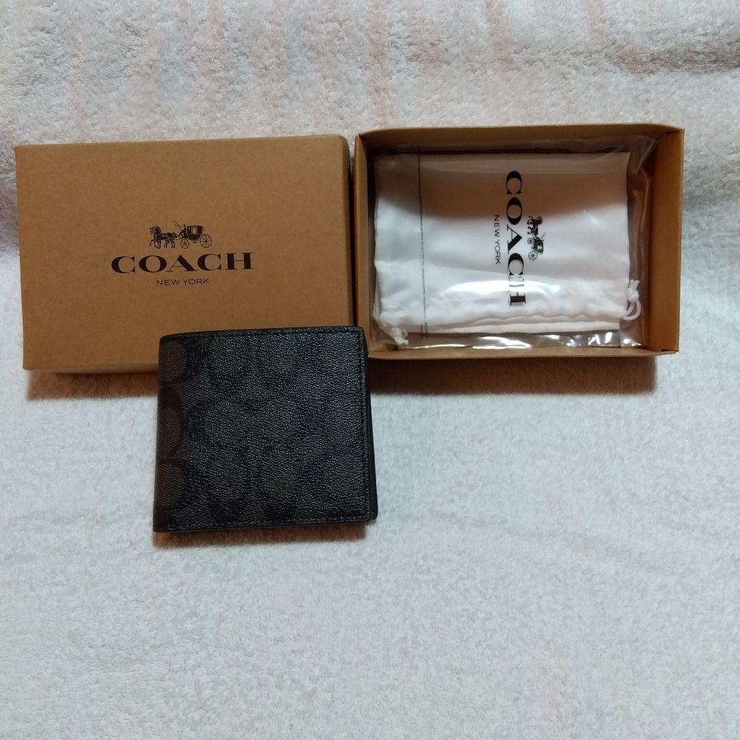 【保障できる】 COACH ブラック メルカリ - 保存袋付き 二つ折り財布 小物