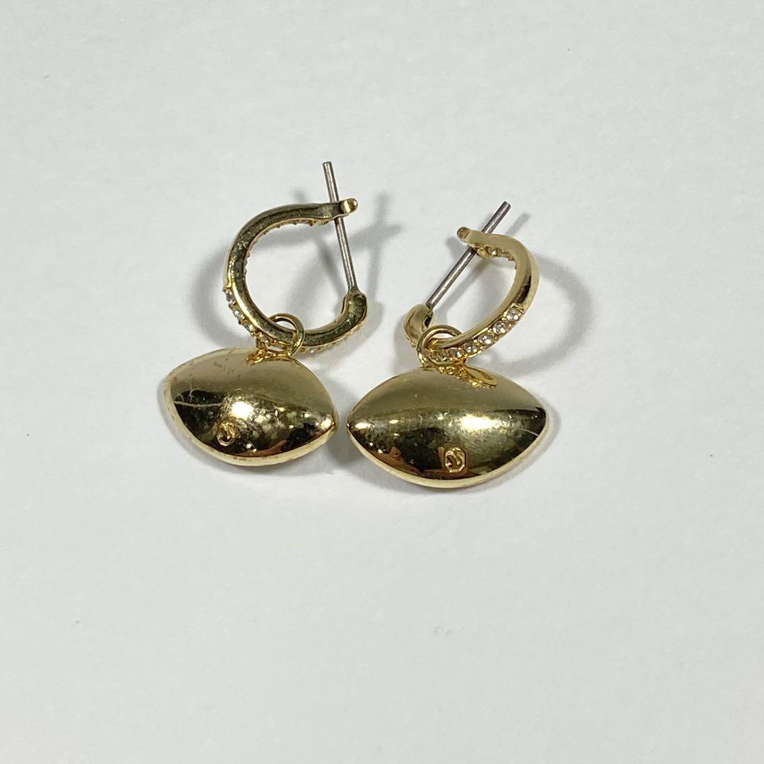人気商品】SWAROVSKI Symbolica イーブルアイ ピアス - メルカリ