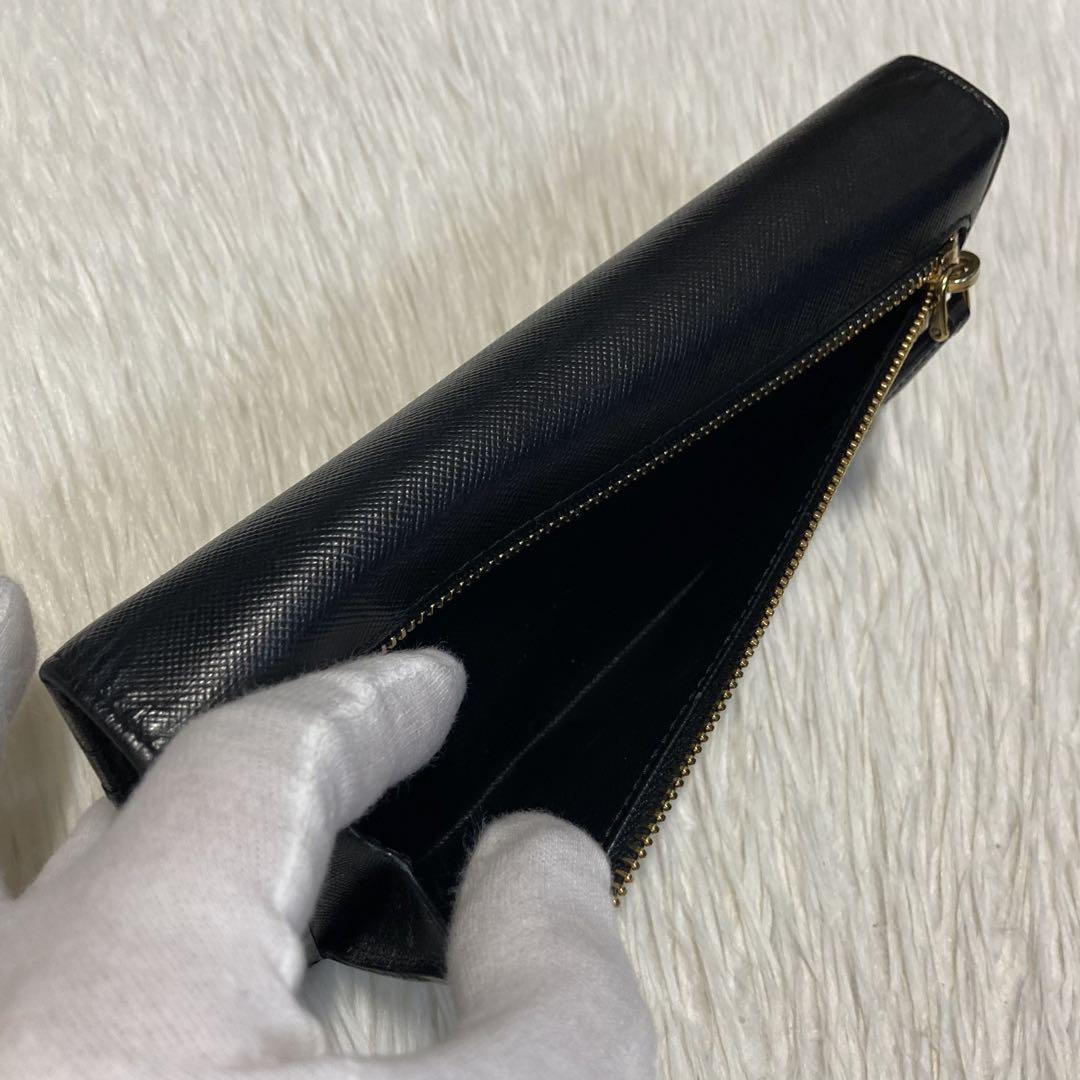 速くおよび自由な 定番人気 美品 黒 リボン 二つ折り 長財布 プラダ PRADA 小物