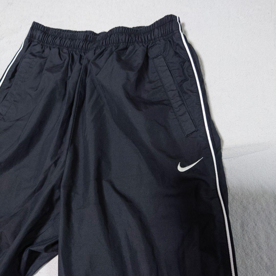 Nike Mサイズ 黒パンツ 新品未使用 Nike 黒 ストレートパンツ サイドラインレディースM - メルカリ