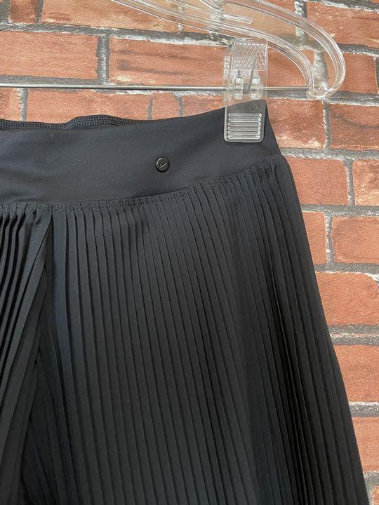 NIKE - 新品 NIKE ナイキ ゴルフウェア プリーツスカート ショートパンツ  ゴルフ 新品 NIKE ナイキ ゴルフウェア プリーツスカート ショート