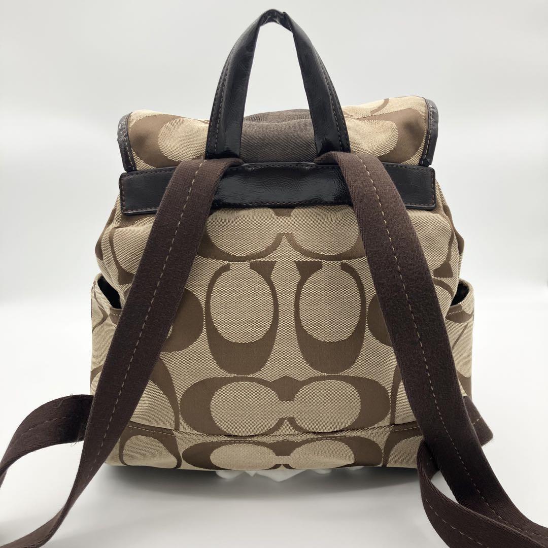 COACH リュック ブラウン ベージュ　シグネチャー 巾着型 F21928