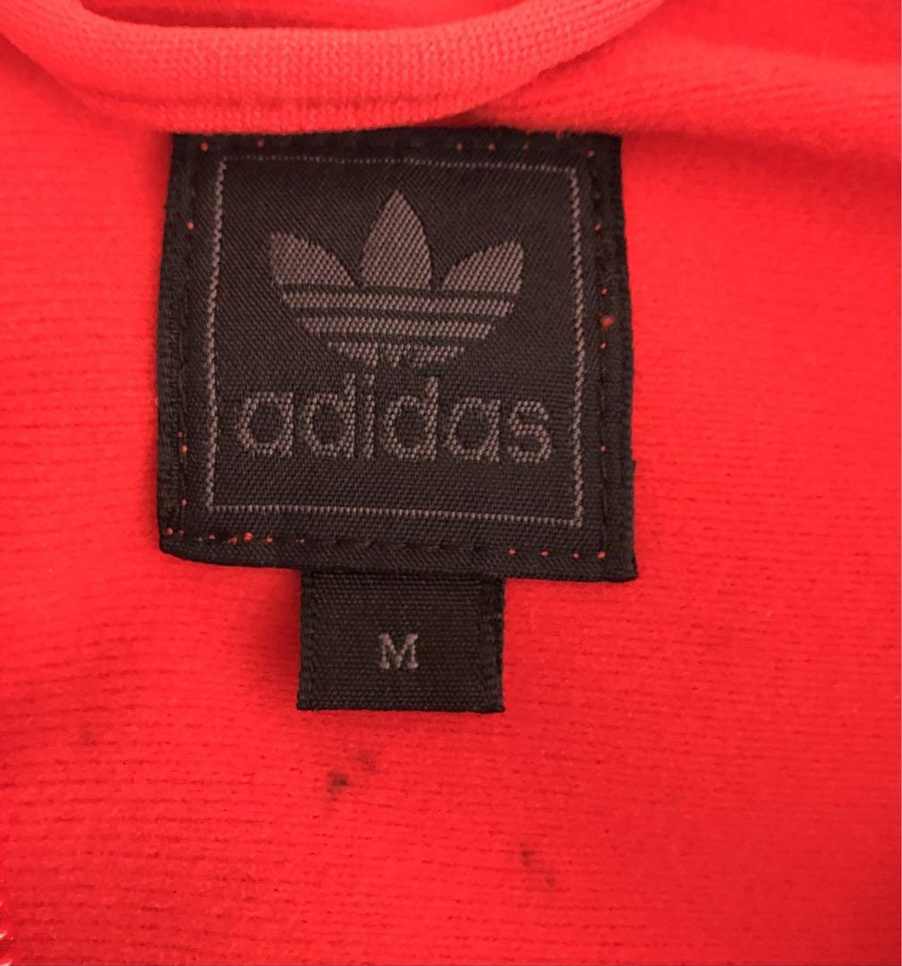 adidasアディダス　ワンポイントロゴ　サイドライン　トラックジャケット。