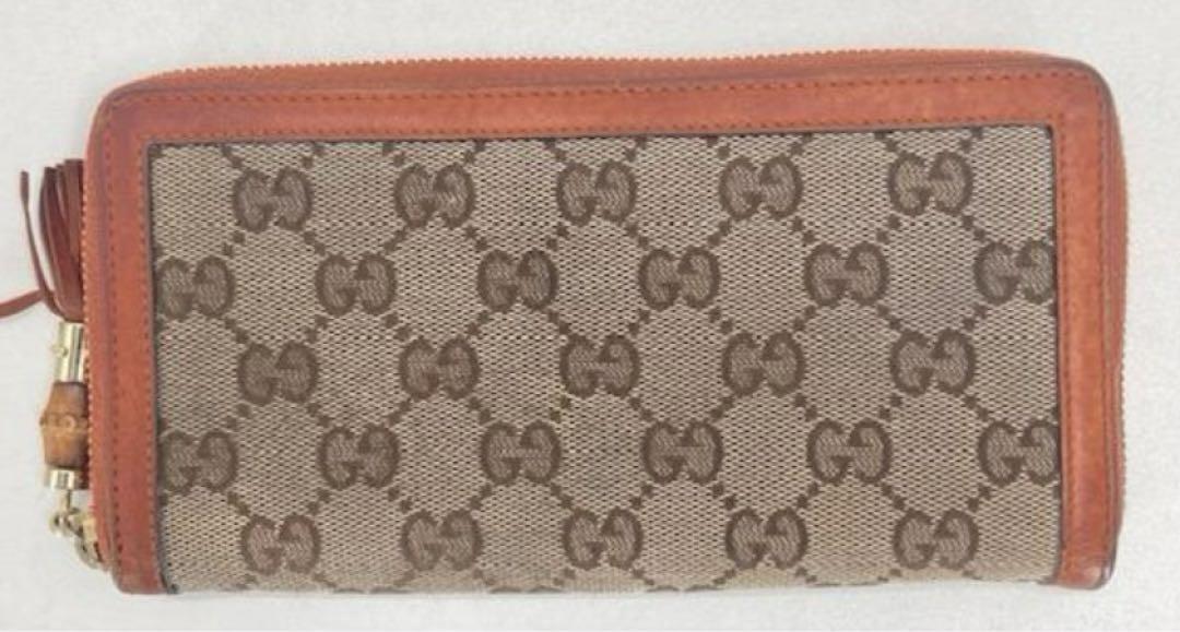 [GUCCI] GGキャンバス ジッピーウォレット　ベージュxオレンジ