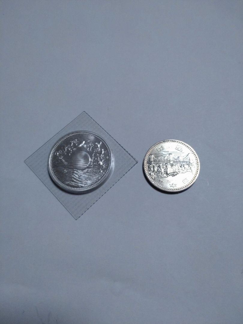 クランチ天皇御在位60年記念10000円銀貨　100円硬貨