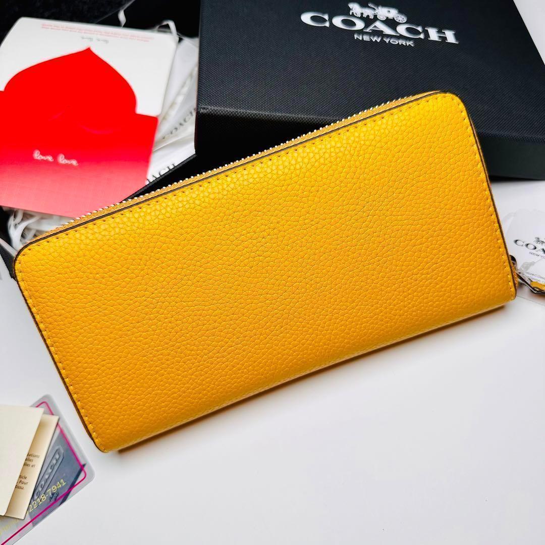 人気Coachレーデイズコーチ長財布イエロー色
