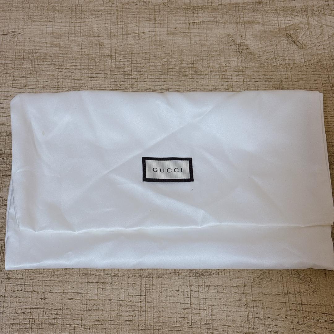 GUCCI GGスプリーム リボン PVC パテント 長財布