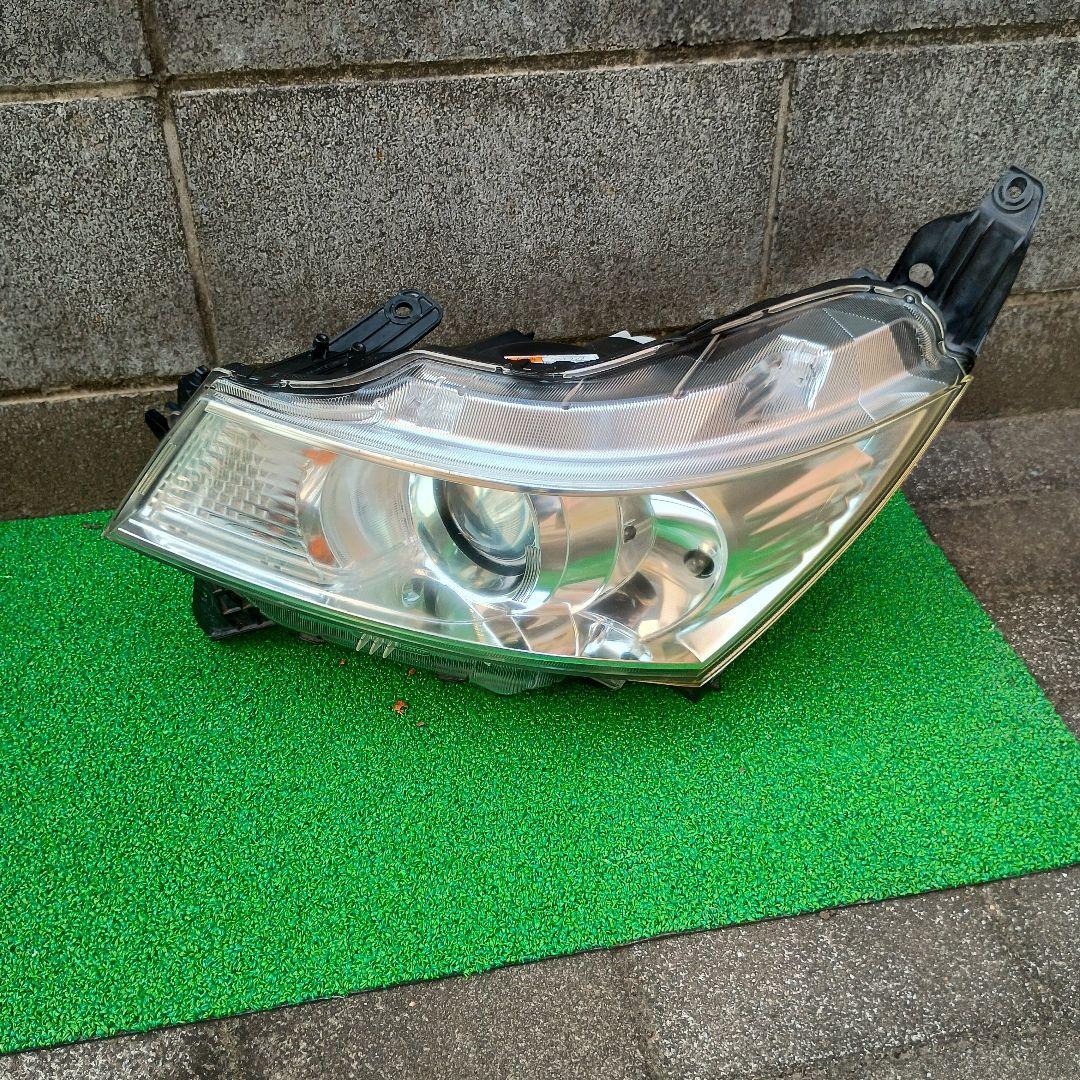 日産 ルークス DBA-ML21S 左ヘッドライトユニット（2010年式）