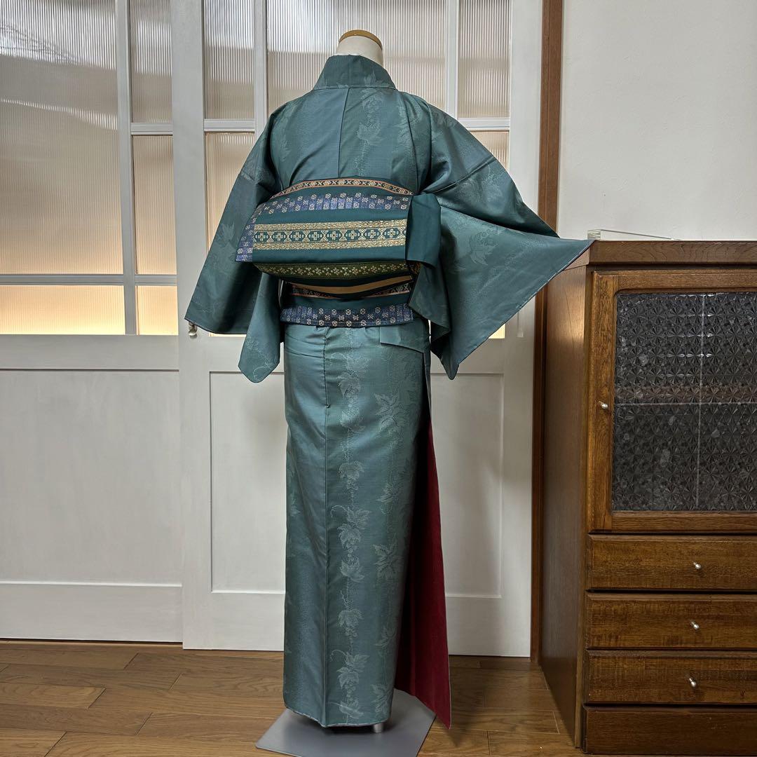 名古屋帯　正絹　深緑色　横段に幾何学模様織り出し　全長364.5幅29.5 名古屋帯 正絹 深緑色 横段に幾何学模様織り出し 全長364.5幅