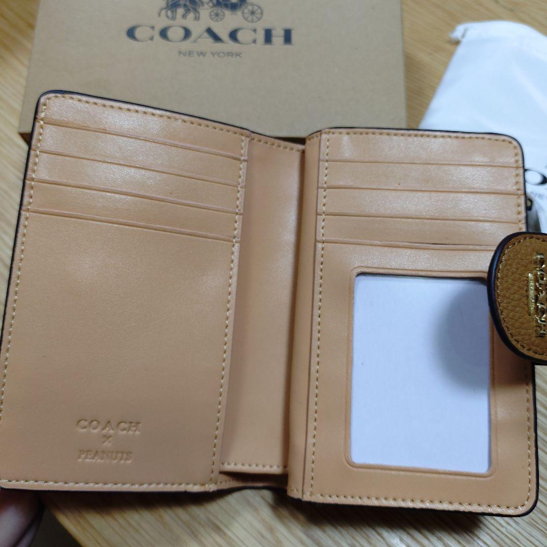 COACH スヌーピー 二つ折り財布 - メルカリ