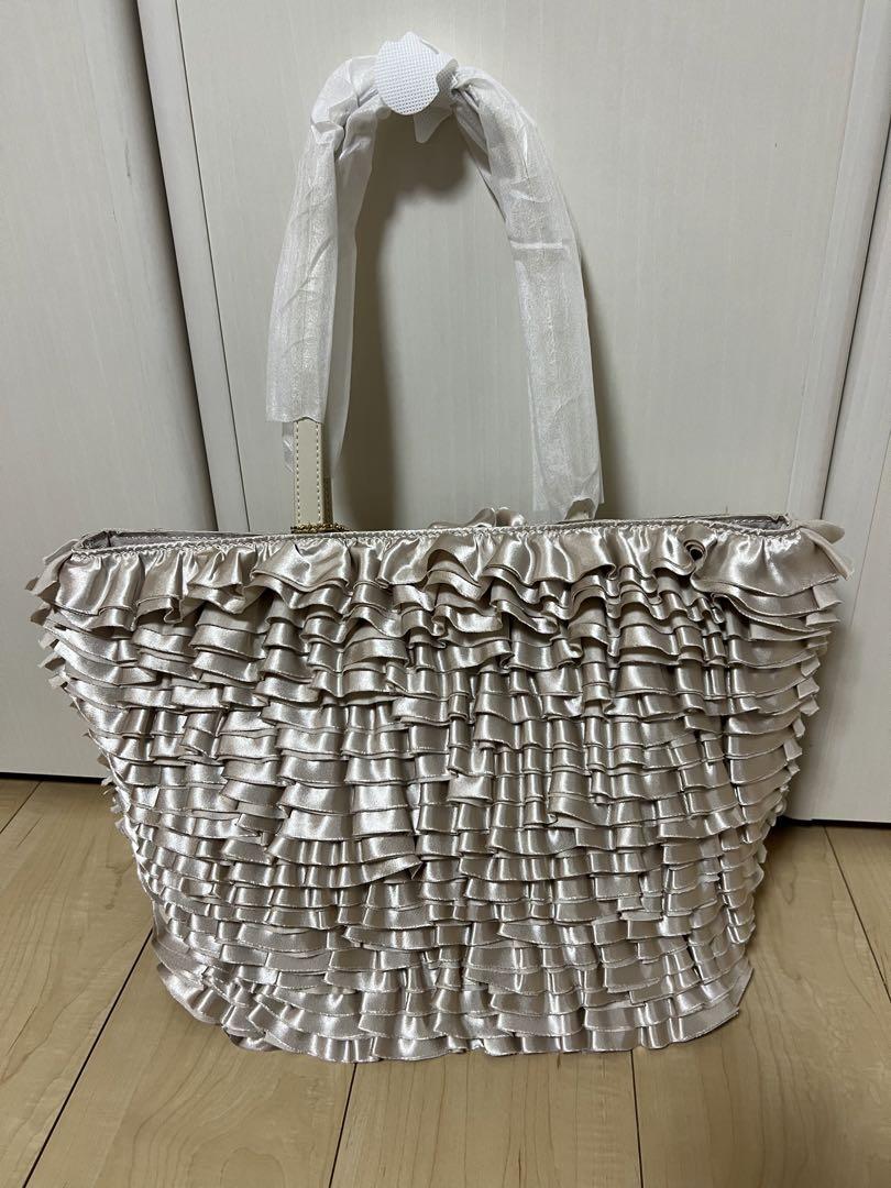 JENNE（ジェンヌ）の「レザーハンドル大人フリルトートバッグ
