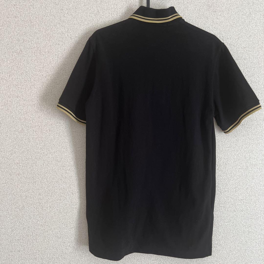 Fred Perry ポロシャツM12 38サイズ　黒×ゴールドストライプ