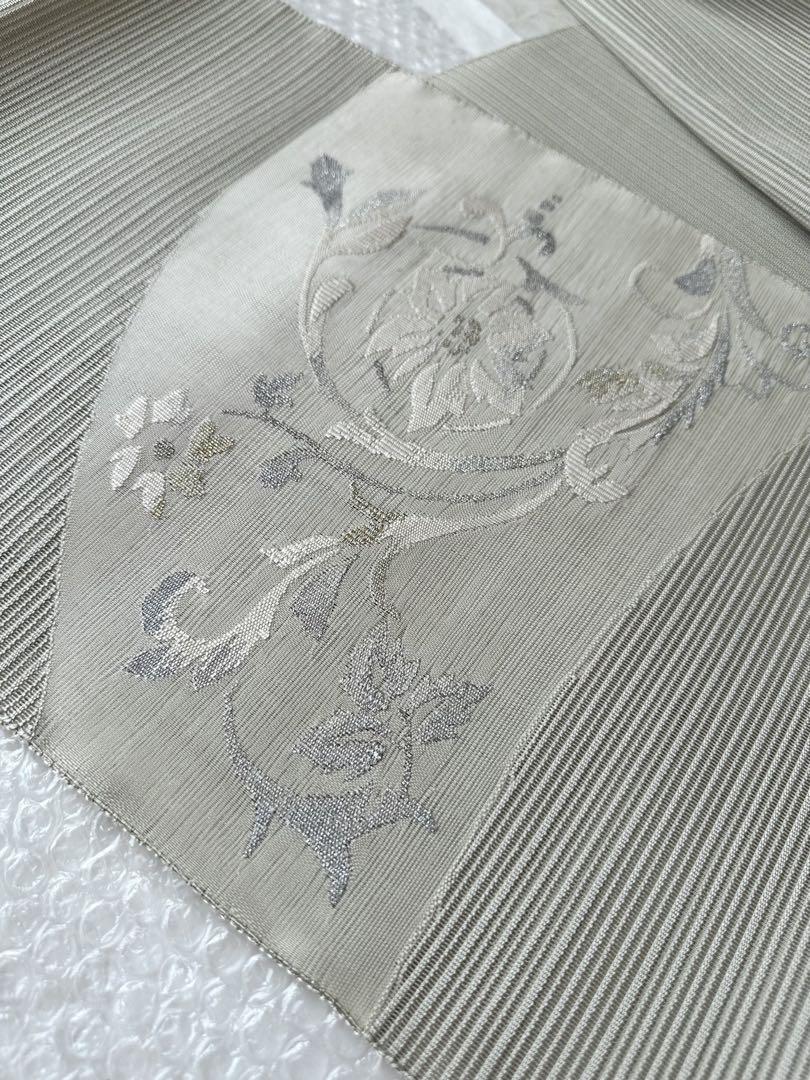 未使用 絽綴れ 花唐草模様織り出し 正絹 名古屋帯