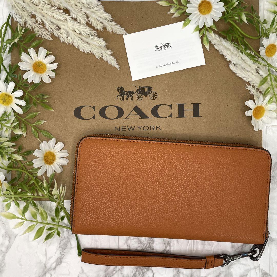 コーチ　COACH 長財布　ブラウン　未使用品　ストラップ付き　馬車柄 新品 未使用 COACH コーチ 長財布 ブラウン 馬車柄 ストラップ