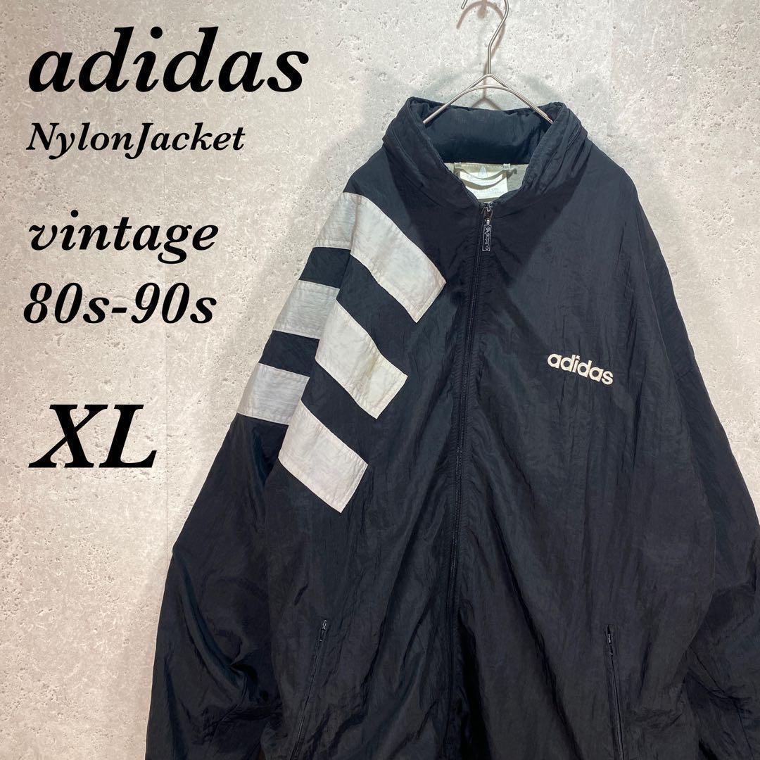 ビンテージUS古着90s万国旗タグ黒adidas 刺繍ロゴ　ナイロンジャケット