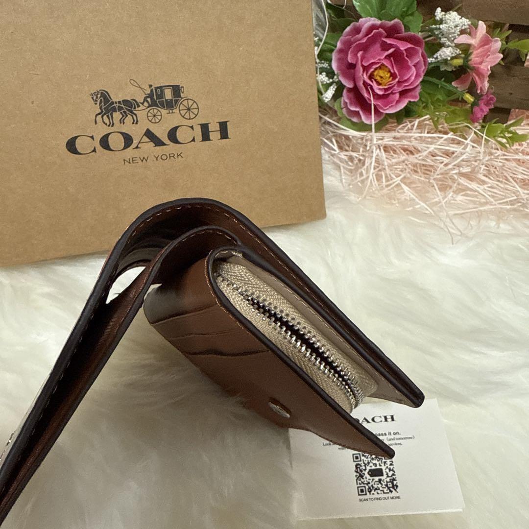 COACH フラワーパターン 二つ折り財布 - メルカリ